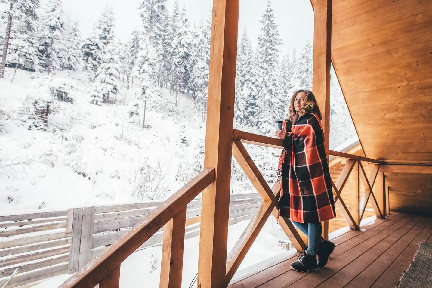 Woman on a wooden balcony